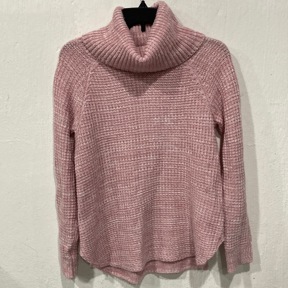 It’s Our Time salmon colored knitted turtleneck.